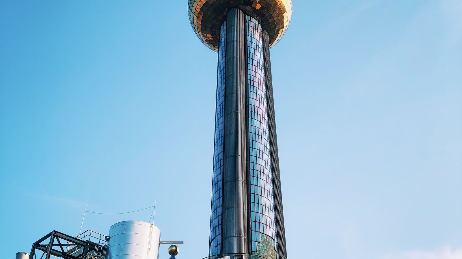 The colourful Hundertwasser-designed Fernwärme Spittelau incinerator tower in Vienna, topped by its golden ball.