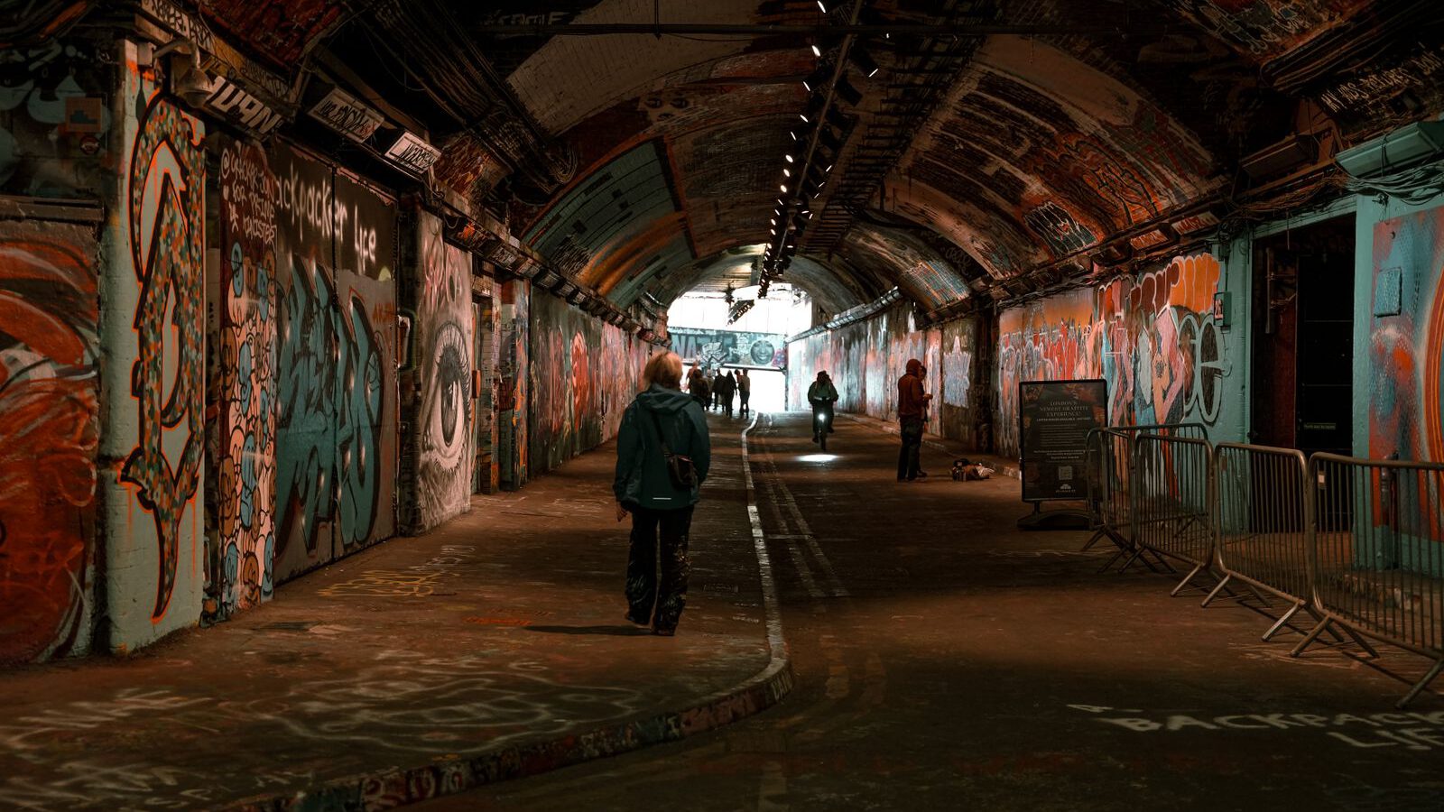 Graffiti-covered walls and arched ceiling of the Leake Street tunnel under Waterloo, London