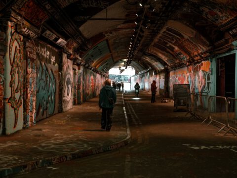 Graffiti-covered walls and arched ceiling of the Leake Street tunnel under Waterloo, London