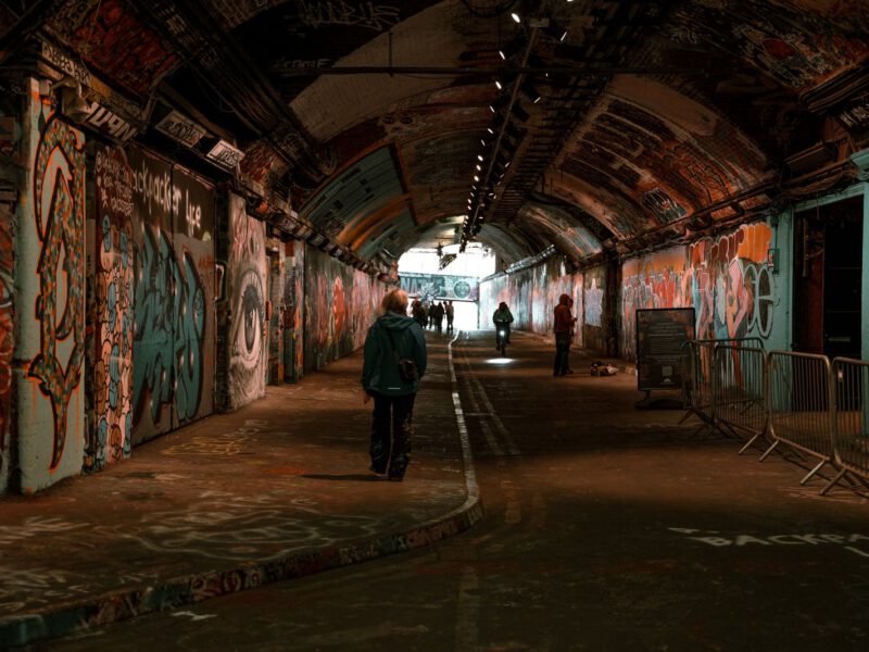 Graffiti-covered walls and arched ceiling of the Leake Street tunnel under Waterloo, London