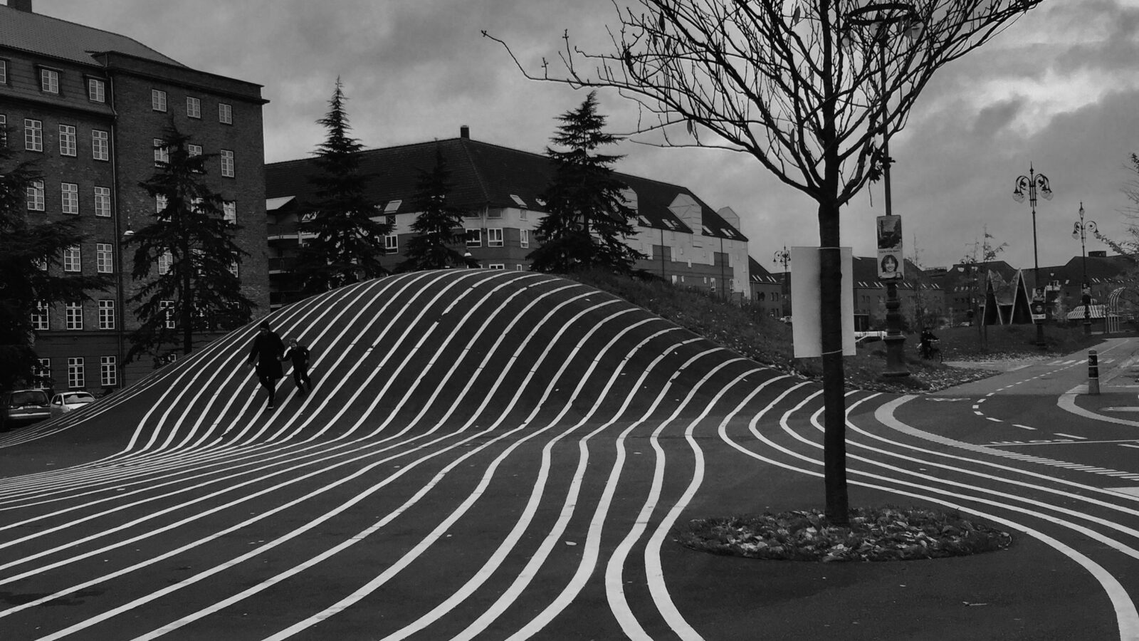 Black and white photo capturing the dynamic lines at Superkilen Park in Copenhagen.