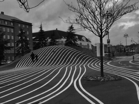 Black and white photo capturing the dynamic lines at Superkilen Park in Copenhagen.
